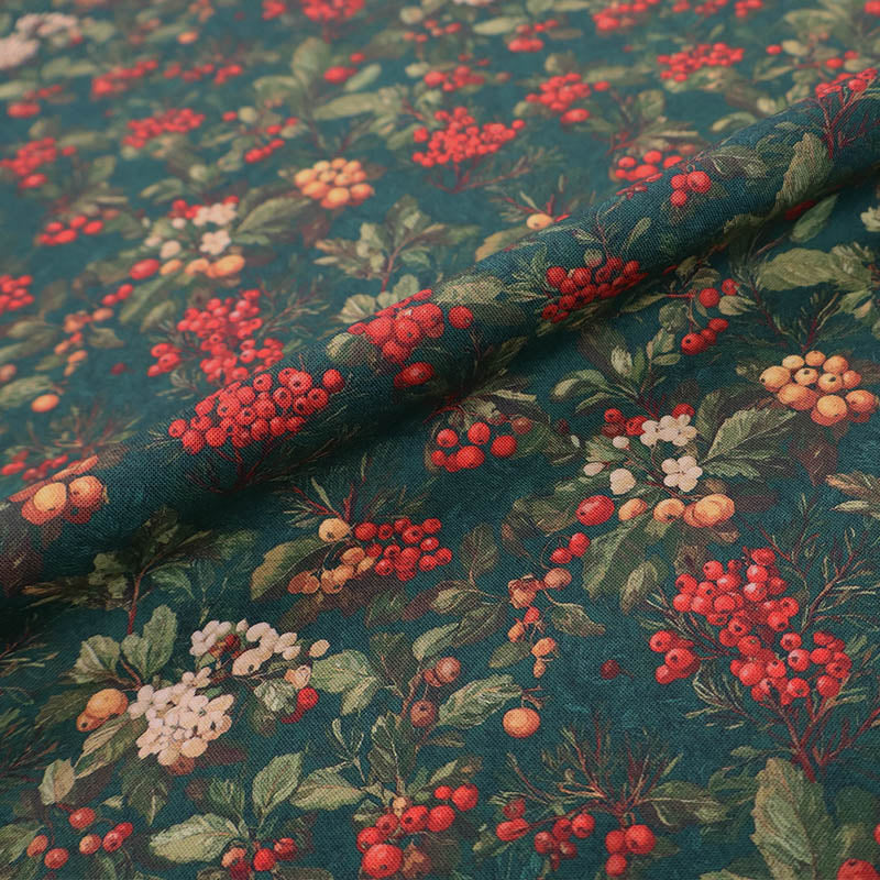 100% Cotton Green Christmas Fabric featuring winter berries in red, white and yellow on a dark green background.