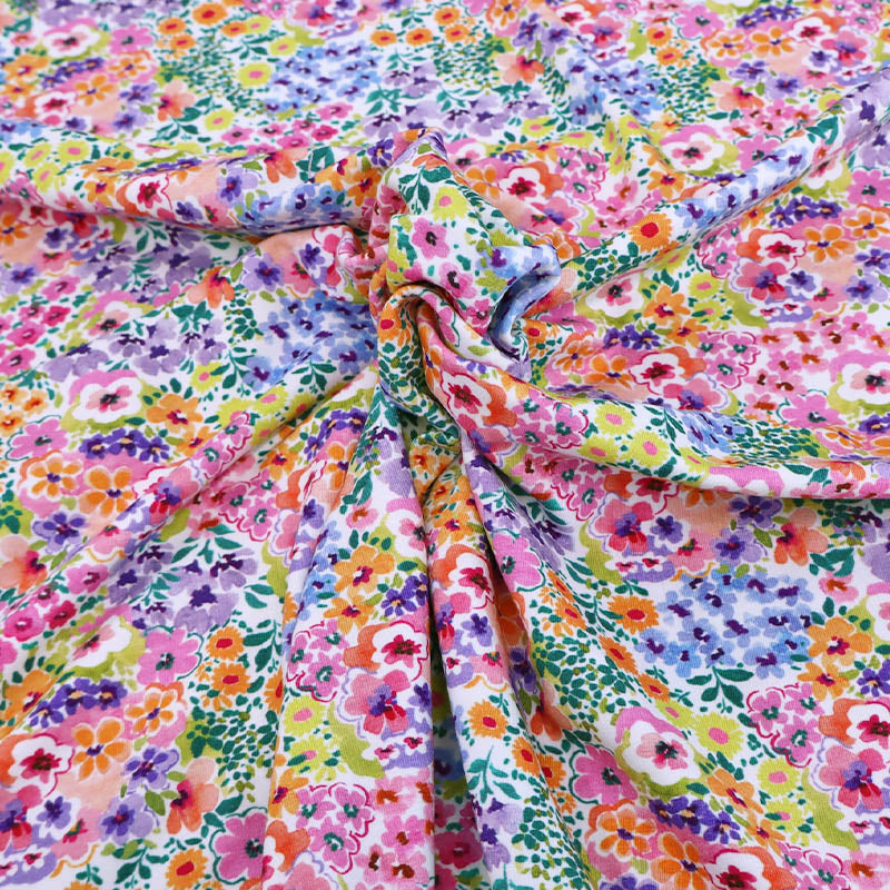 95% Cotton 5% Elastane
Multi Coloured Floral Jersey Fabric in pink, purple, blue, orange and yellow on white