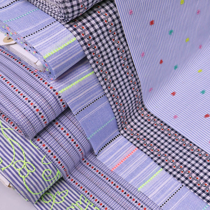 embroidered cotton fabrics in various colours