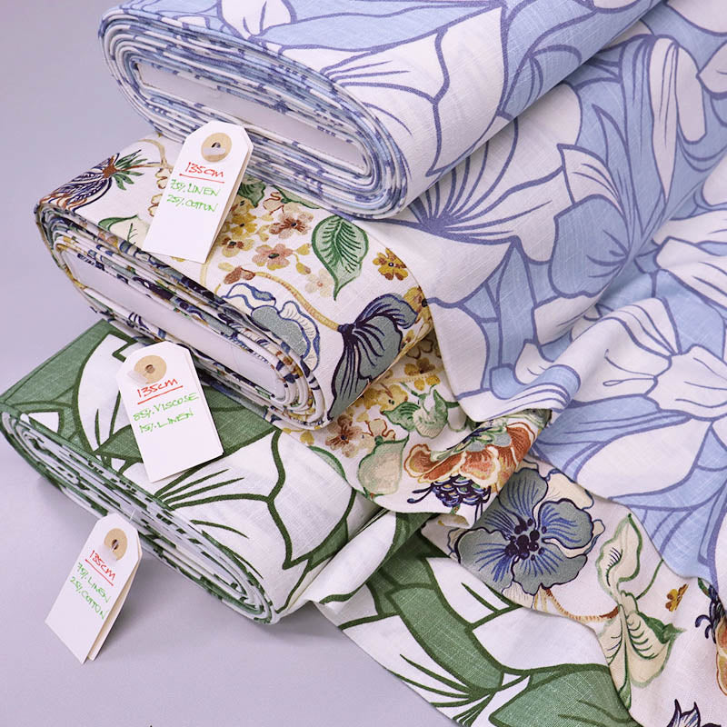 Linen blend floral fabrics in blue and white, green and white and multicoloured