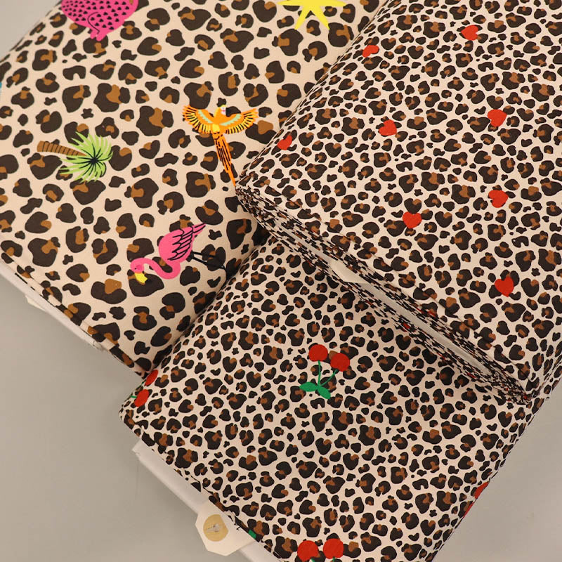 Leopard print jersey fabrics with hearts, cherries and tropical motifs