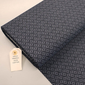 100% Cotton Geometric Fabric - Black and Grey with a small grey geometric leaf print on a solid black background.