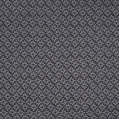100% Cotton Geometric Fabric - Black and Grey with a small grey geometric leaf print on a solid black background.