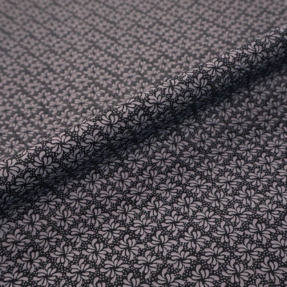 100% Cotton Geometric Fabric - Black and Grey with a small grey geometric leaf print on a solid black background.
