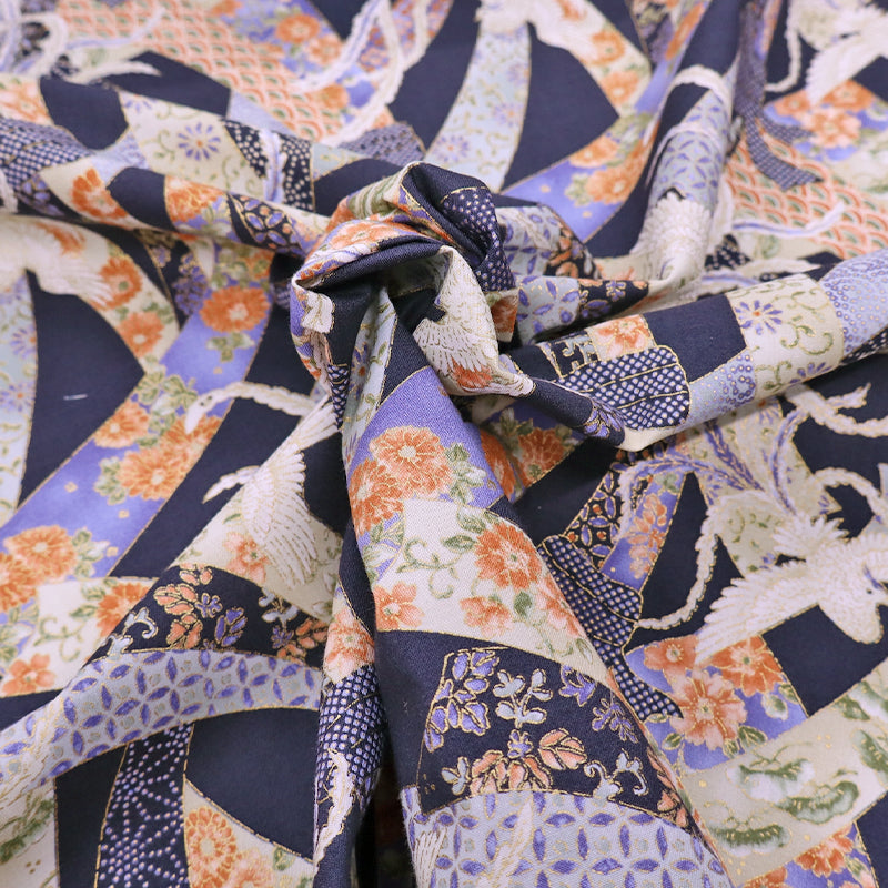 Japanese fabric featuring an intricate design of doves and floral ribbons on a dark blue background. In 100% cotton