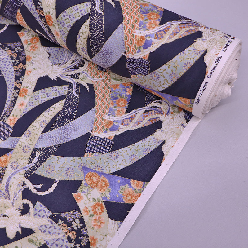 Japanese fabric featuring an intricate design of doves and floral ribbons on a dark blue background. In 100% cotton