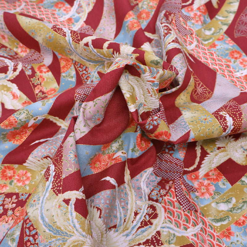 Japanese fabric featuring an intricate design of doves and floral ribbons on a rust red background. In 100% cotton