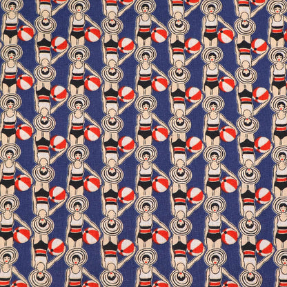 Patterned fabric with women in swimsuits and beach balls on a blue background