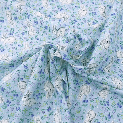 blue linen look cotton fabric with a cute rabbit and floral print