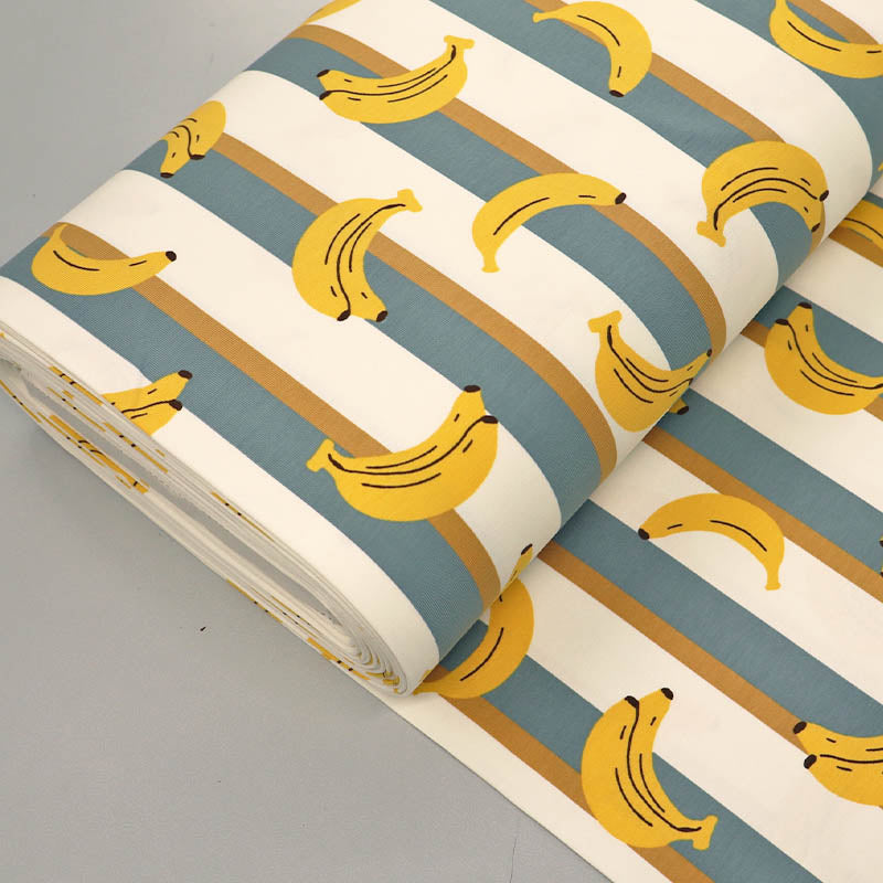 95% Cotton 5% ElastaneJersey Fabric - Banana Print on a teal and Cream Stripe