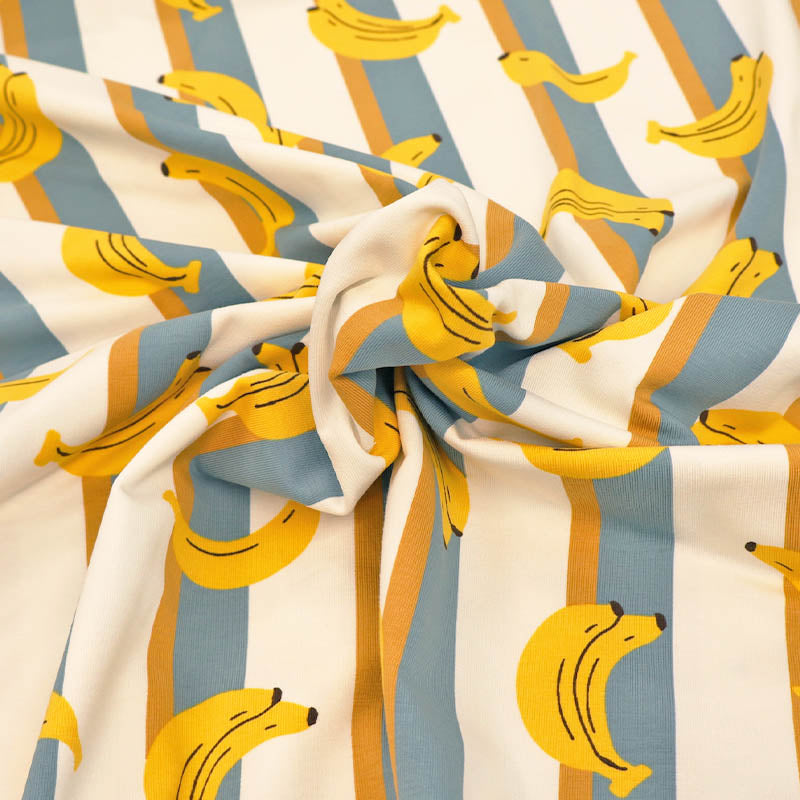 95% Cotton 5% ElastaneJersey Fabric - Banana Print on a teal and Cream Stripe