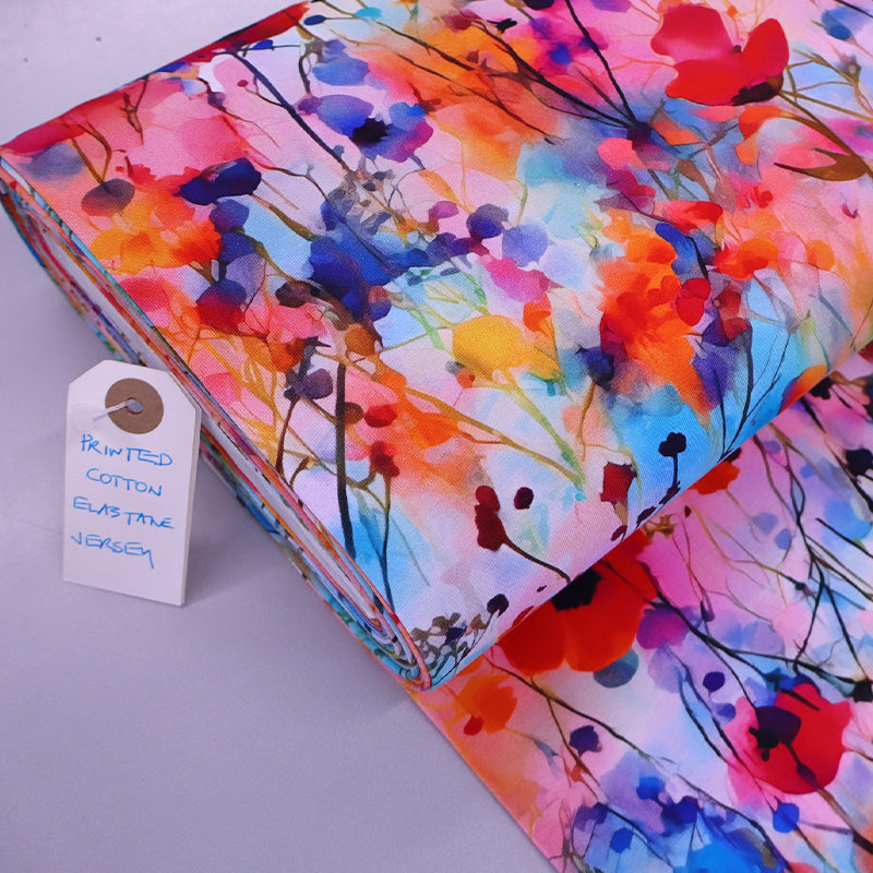 95% Cotton 5% Elastane Watercolour Floral Jersey Fabric - Digital Print in red, pink, orange and blue