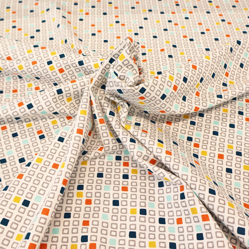 92% Cotton 8% Elastane JerseyFabric with a colourful square pattern on a beige background