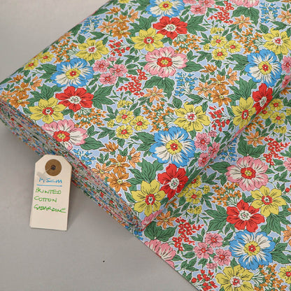 100% Cotton Gabardine Fabric - Yellow Floral with blue and pink flowers