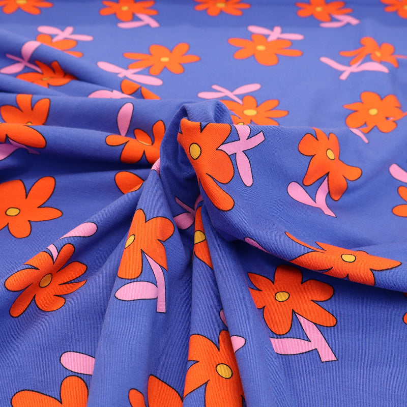 95% Organic Cotton 5% Elastane
Blue Floral Jersey Fabric with Red Daisy