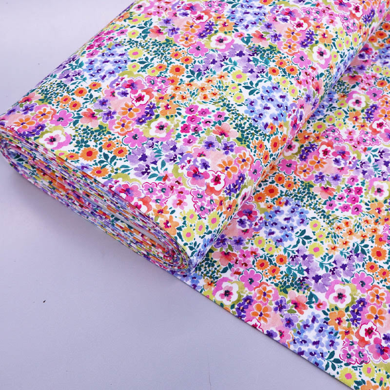 95% Cotton 5% Elastane
Multi Coloured Floral Jersey Fabric in pink, purple, blue, orange and yellow on white 