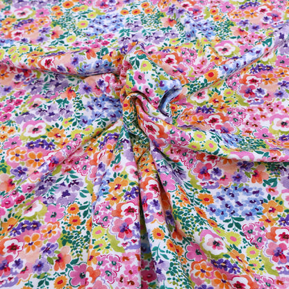 95% Cotton 5% Elastane
Multi Coloured Floral Jersey Fabric in pink, purple, blue, orange and yellow on white 