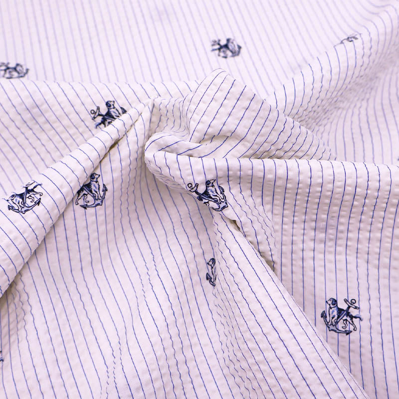 100% Cotton Deadstock Seersucker Fabric - Blue and Cream Stripe with dog and anchor pattern