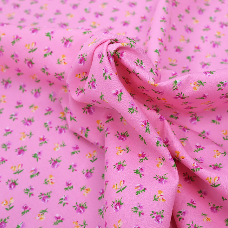 100% Cotton Ditsy Floral Pink Poplin Fabric - pink and yellow flowers on sugar pink background