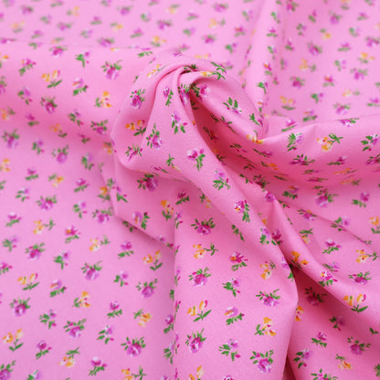 100% Cotton Ditsy Floral Pink Poplin Fabric - pink and yellow flowers on sugar pink background