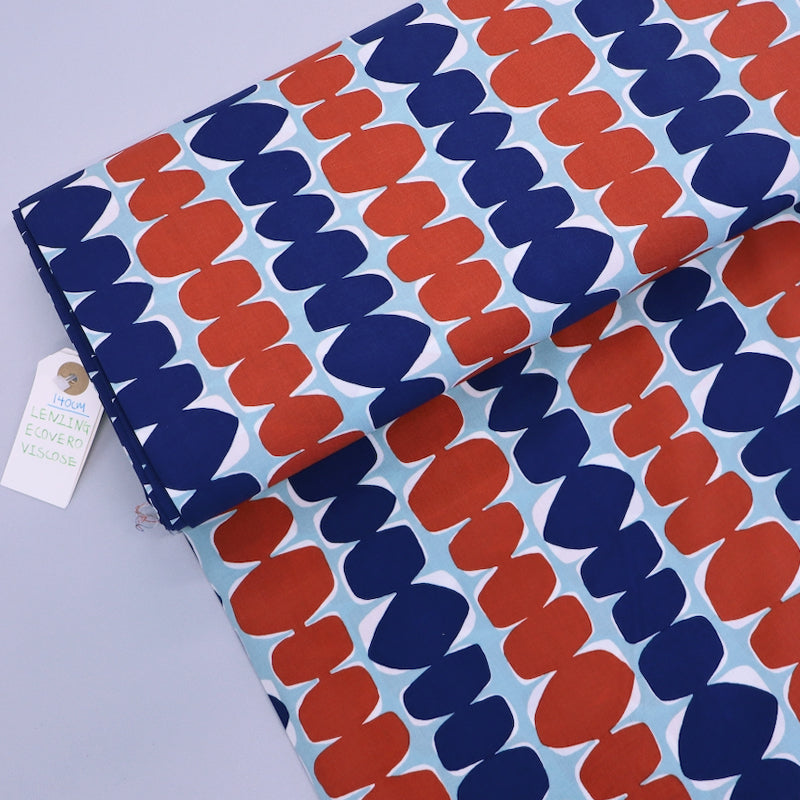 100% Ecovero Viscose Fabric - Dark Blue and Red abstract design on pale blue background