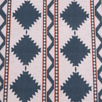  Linen and viscose blend furnishing fabric in a bold diamond shaped geometric print in petrol blue with red lines on a cream background. 