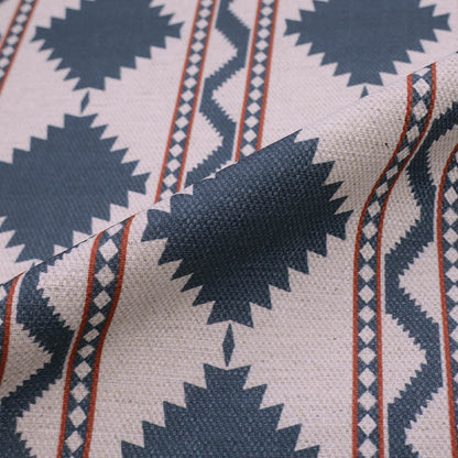  Linen and viscose blend furnishing fabric in a bold diamond shaped geometric print in petrol blue with red lines on a cream background. 