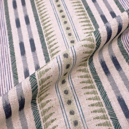  linen blend furnishing fabric featuring an unusual stripe type print in soft green and purple on a cream natural coloured background. 