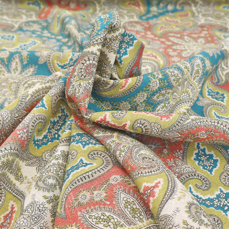  80% Viscose 20% Linen Linen Blend Paisley Furnishing Fabric with a paisley print in muted orange, yellow and blue. 