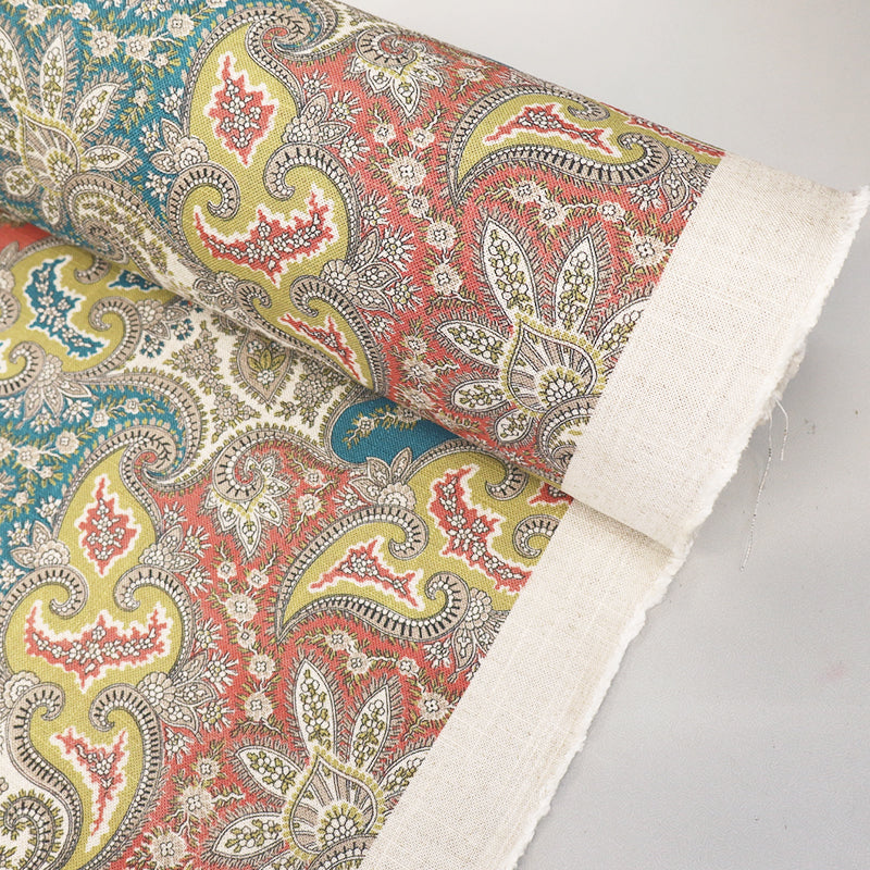  80% Viscose 20% Linen Linen Blend Paisley Furnishing Fabric with a paisley print in muted orange, yellow and blue. 