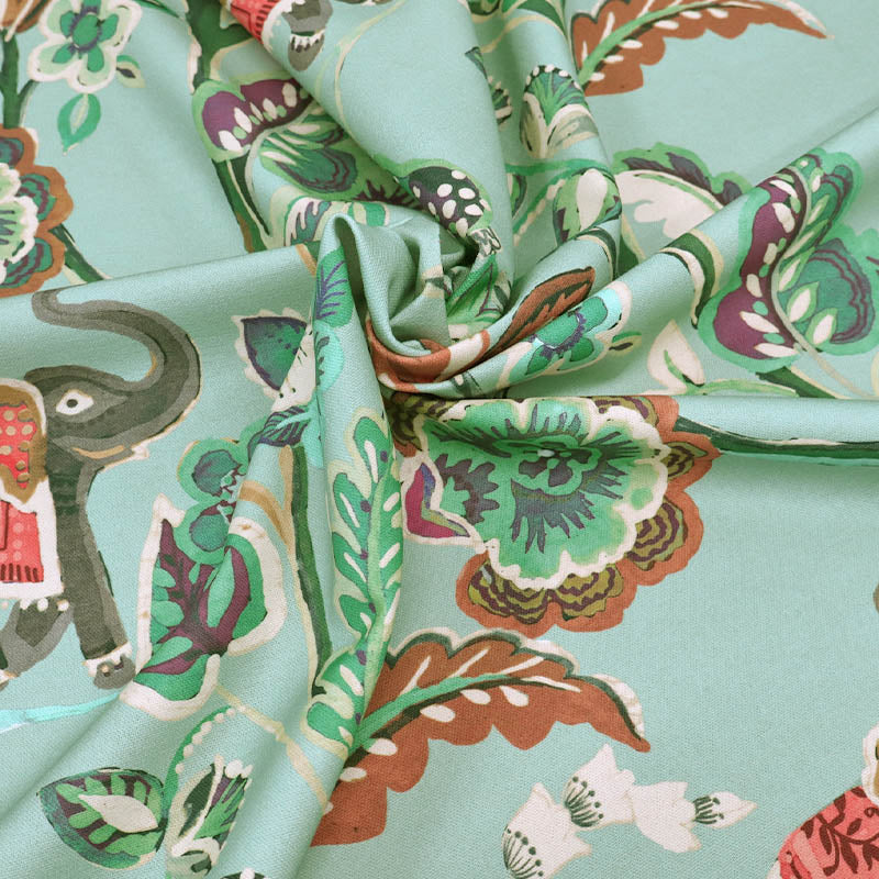 100% Cotton Duck Egg Blue Panama Fabric - Elephant Tropical Print on a duck egg blue background.
