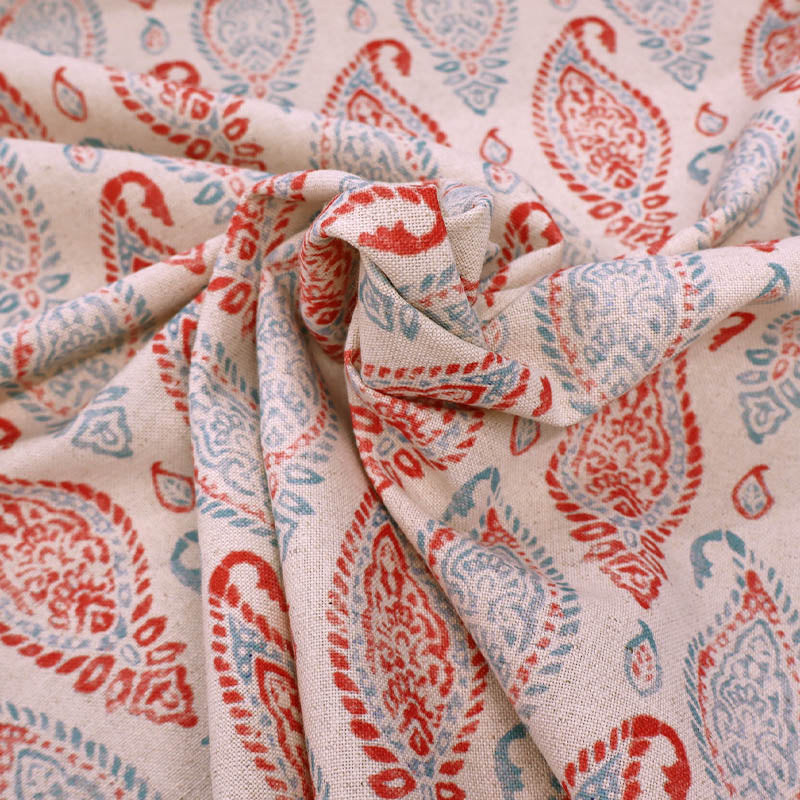 90% Cotton 10% Linen Linen Look Furnishing Fabric - Red & Blue Paisley Print on a cream background