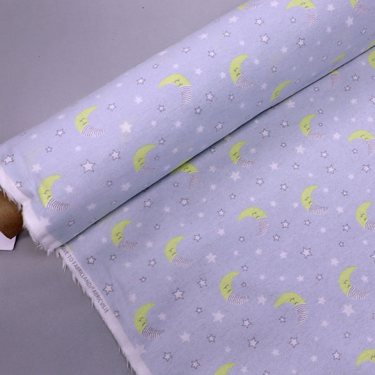 100% Cotton Pale Grey Brushed Cotton Fabric with yellow crescent moons dressed in night caps and with small white stars on a very pale grey background.