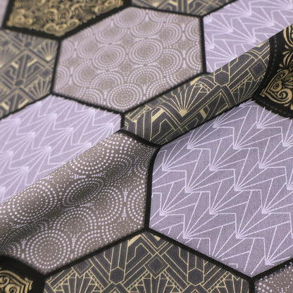 100% Cotton Great Value  Fabric  featuring a grey and cream hexagon print in which 4 different geometric designs are outlined in black.