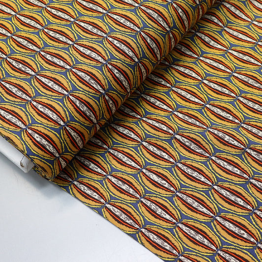 Grey viscose fabric with a multicolour orange papaya print