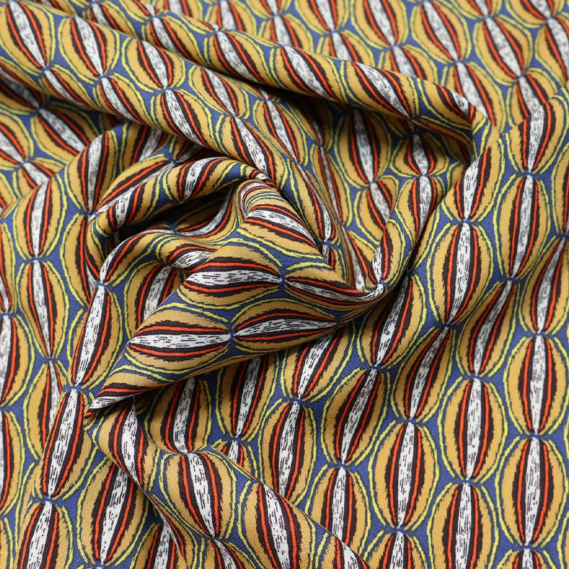 Grey viscose fabric with a multicolour orange papaya print