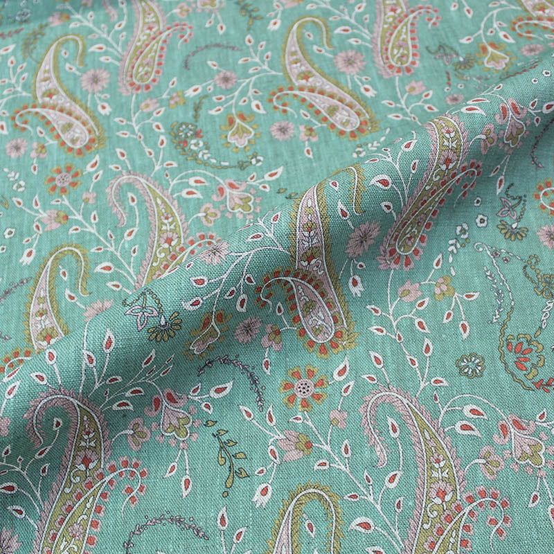 Green paisley linen furnishing fabric