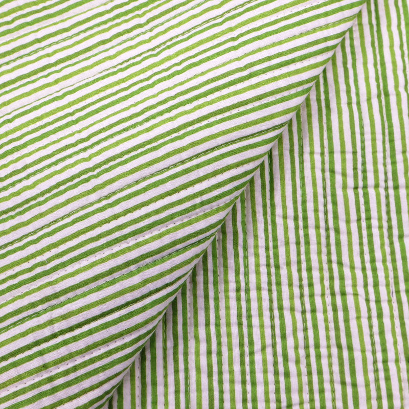 100% Cotton, including 100% Cotton Wadding Quilted Cotton Fabric - Green and Pink Floral with green stripe on the reverse