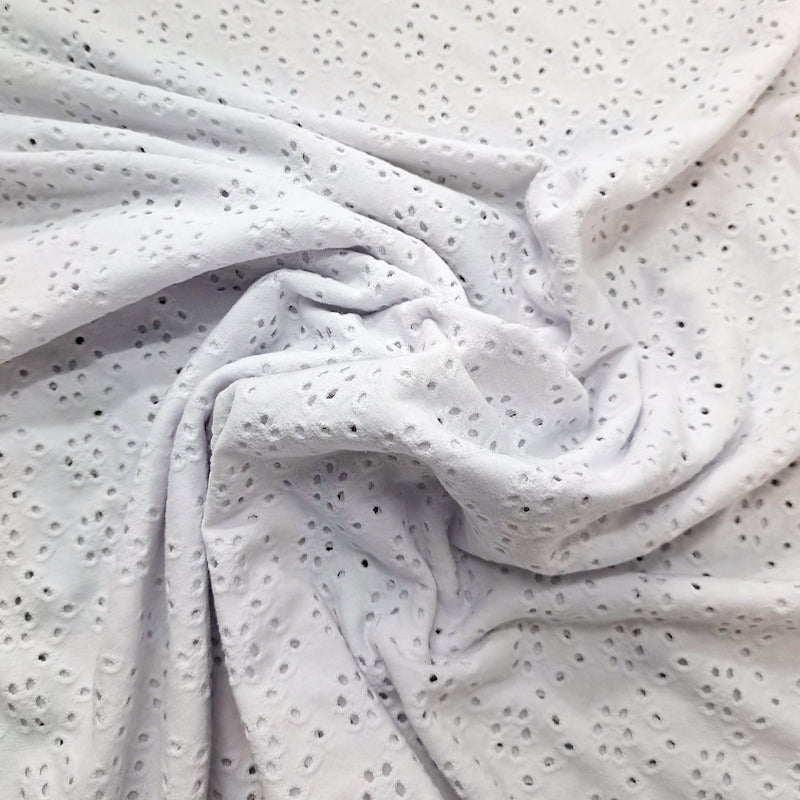 80% Cotton 15% Polyester 5% Elastane   White Jersey Broderie Anglaise Fabric 