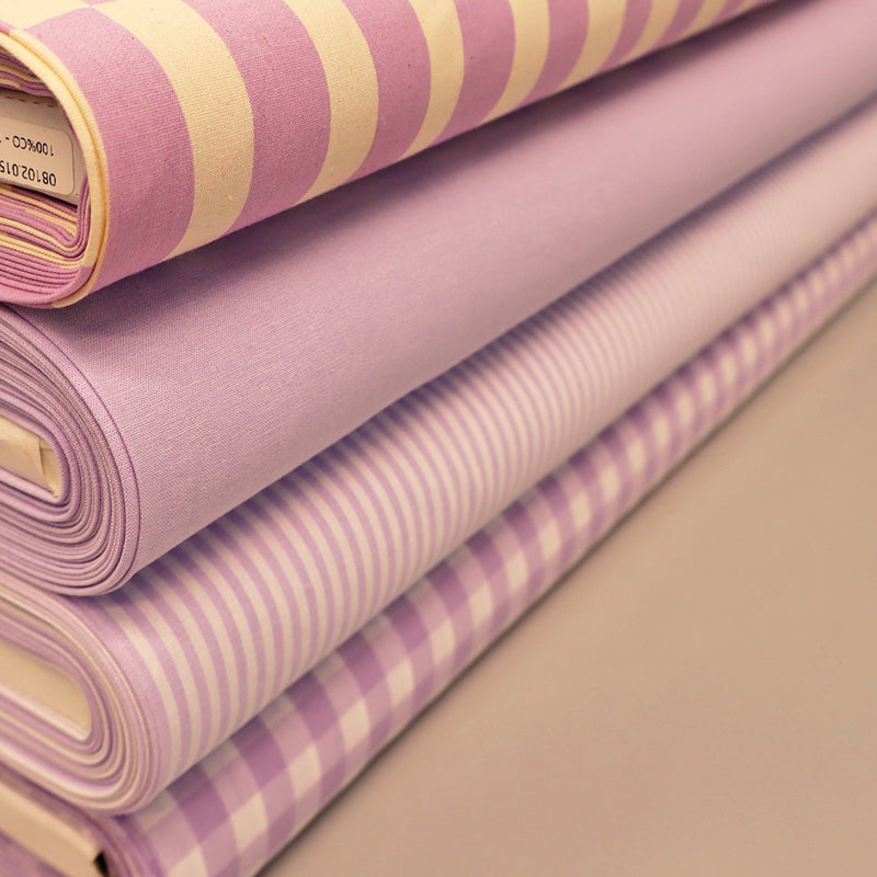 Lilac fabrics including plain, gingham, stripe and geometric prints