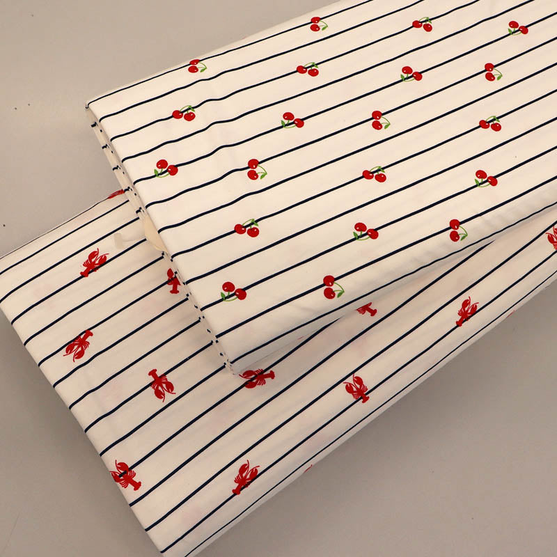 Navy Striped white jersey fabrics with a cherry and lobster print