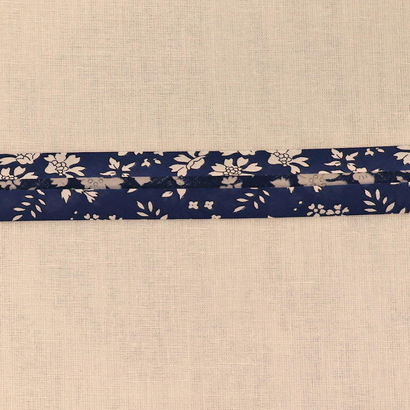 100% Cotton Liberty Fabric Bias Binding  in their Capel design featuring a white floral print on a navy blue background.