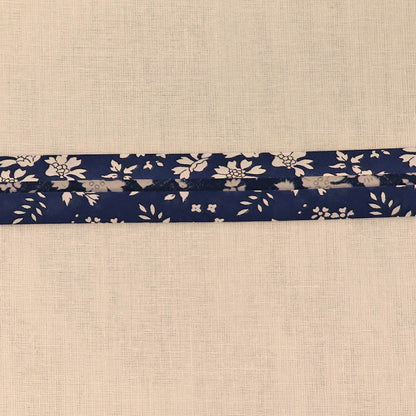 100% Cotton Liberty Fabric Bias Binding  in their Capel design featuring a white floral print on a navy blue background.