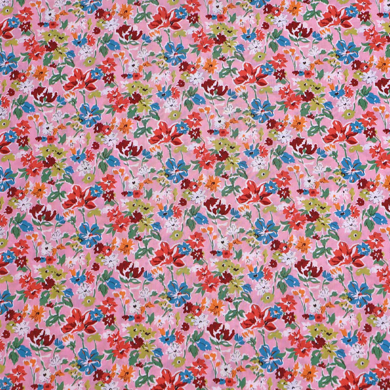 100% Cotton Liberty Cotton Lawn Fabric - Pink Floral featuring a pretty pink, orange, red and blue floral print on a pale pink background. 