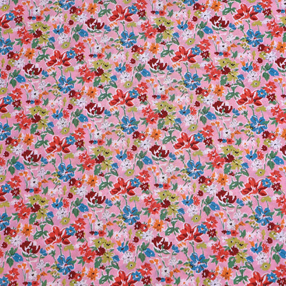 100% Cotton Liberty Cotton Lawn Fabric - Pink Floral featuring a pretty pink, orange, red and blue floral print on a pale pink background. 