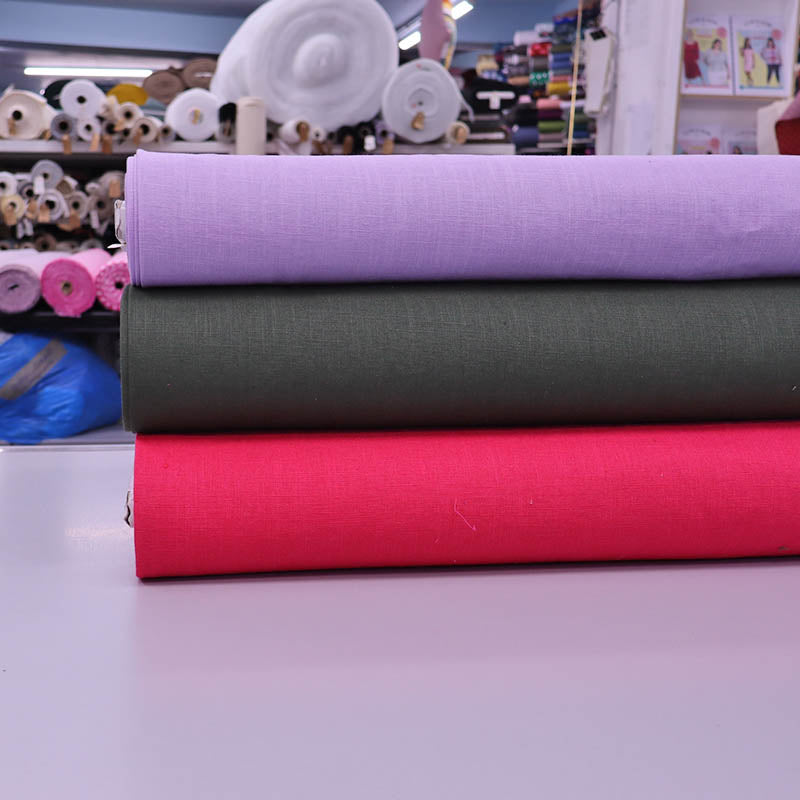 Linen fabrics in purple, black and bright pink