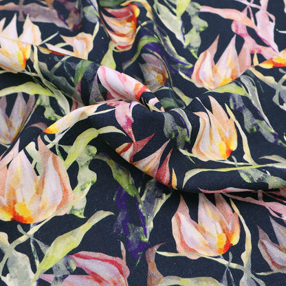 70% Viscose 30% Linen blend Fabric - Dark Blue Floral featuring a watercolour style floral print in peach yellow and orange with green leaves on a dark navy blue background.