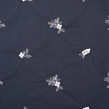 100% Cotton Embroidered Cotton Floral Fabric featuring pale blue floral and leaf motifs on a dark blue light weight cotton base cloth
