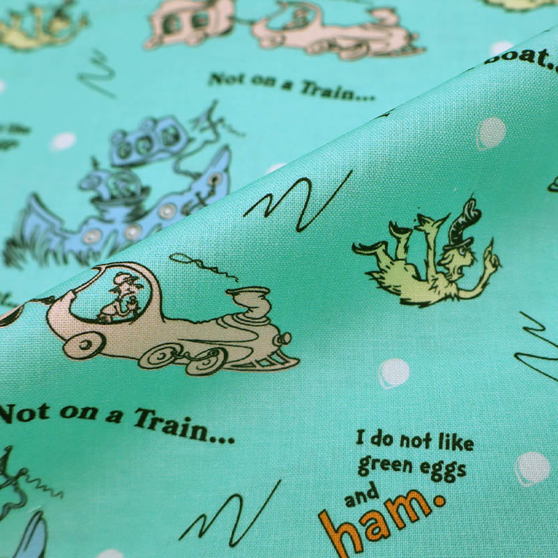 100% Cotton The Cat in the Hat Fabric in Green with scenes from Green Eggs and Ham