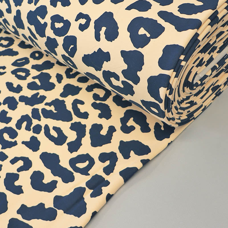 82% Organic Cotton 18% Recycled Polyester Cream Sweatshirt fabric with navy blue Leopard Print